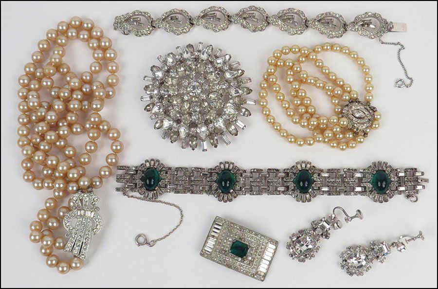 A JOSEPH MAZER WHITE RHINESTONE BRACELET. $150/$250: A JOSEPH MAZER WHITE RHINESTONE BRACELET. $150/$250 Together with an Art Deco style faux emerald and white rhinestone bracelet, a faux emerald and white rhienstone dress clip, a double strand of faux