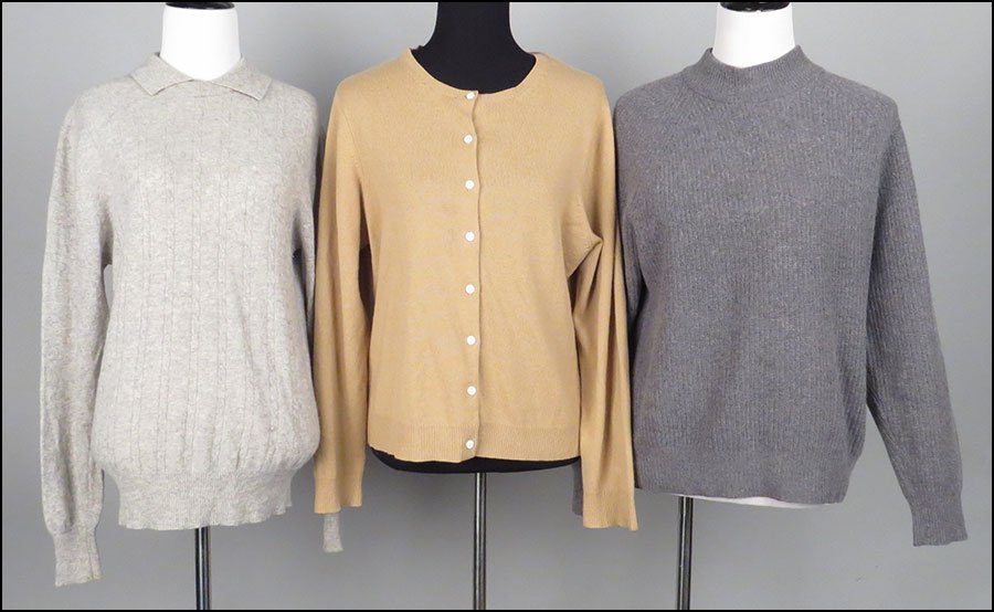 GROUP OF FIVE CASHMERE SWEATERS. Various sizes, from: GROUP OF FIVE CASHMERE SWEATERS. Various sizes, from Large to Extra Large $100/$200 Comprised of cardigans and pull-over sweaters from Bloomingdales, Lord & Taylor, and Jaeger in navy, camel, gray, sl