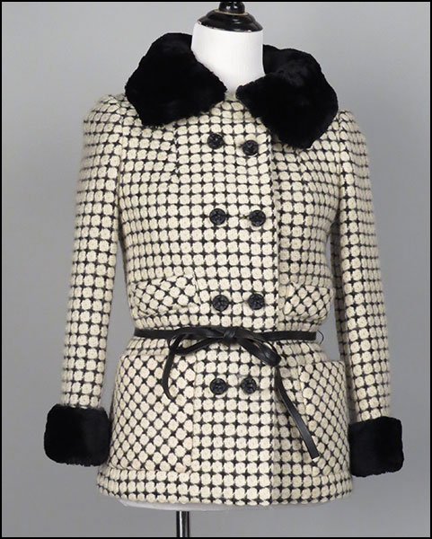 JACK FEIT NEW YORK BLACK AND WHITE WOOL PRINT TWO-PIECE: JACK FEIT NEW YORK BLACK AND WHITE WOOL PRINT TWO-PIECE ENSEMBLE. Size 8 $100/$150 Comprised of a skirt and a jacket. Both lined. Bearing a Phil Handmacher's Chicago 'hand-moor' tag. With black beaver