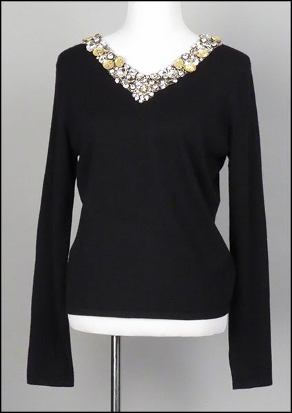 NAEEM KHAN TWO-PIECE ENSEMBLE. Size XL $100/$150: NAEEM KHAN TWO-PIECE ENSEMBLE. Size XL $100/$150 Comprised of a black cashmere sweater bearing a rhinestone beaded v-neckline and a pair of pants. Provenance: From the Estate of Frances R. Dittmer