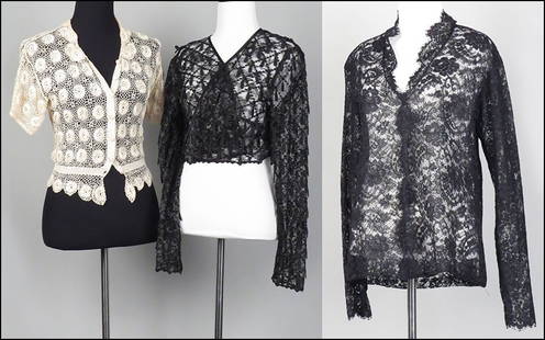 A CAROLYN ROEHM BLACK LACE BUTTON-FRONT SHIRT. Size: A CAROLYN ROEHM BLACK LACE BUTTON-FRONT SHIRT. Size unlabeled $75/$125 Together with a cream colored crocheted cropped sweater and an Escada couture black lace cropped sweater (size 42)