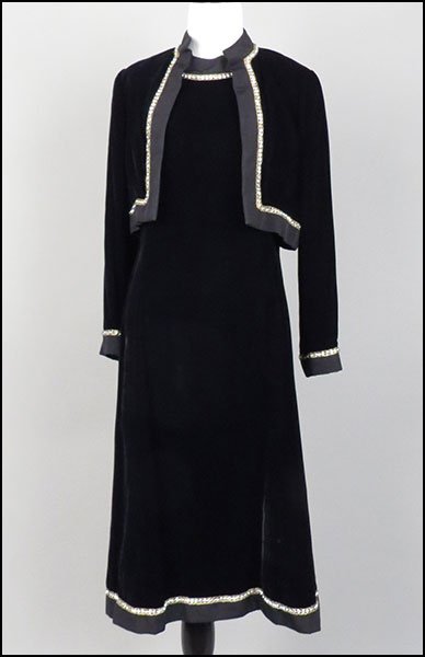 MALCOM STARR BLACK VELVET TWO-PIECE ENSEMBLE. Size 12: MALCOM STARR BLACK VELVET TWO-PIECE ENSEMBLE. Size 12 $100/$200 Comprised of a sleeveless dress and a cropped jacket. Dress is trimmed in rhinestone and goldtone thread at the neck and bottom skirt he