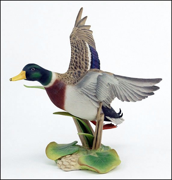 A BOEHM PORCELAIN MALLARD DUCK.: A BOEHM PORCELAIN MALLARD DUCK. Anas platyrhynchos. 10203 Number 12. Inscribed underneath "Best wishes The Boehm Studios George Barker 5/31/91" H: 11" W: 15" D: 10"