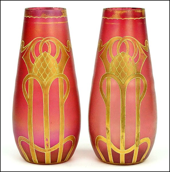 PAIR OF LOETZ STYLE IRISDESCENT GLASS VASES.: PAIR OF LOETZ STYLE IRISDESCENT GLASS VASES. Unsigned. Bearing a gold colored textured design Pair H: 10''