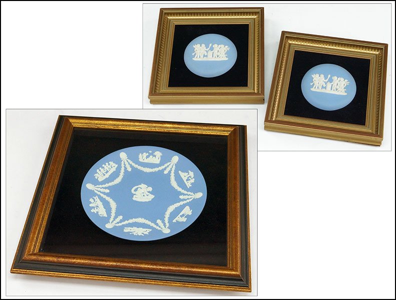 WEDGWOOD BLUE JASPERWARE FRAMED PLATE.: WEDGWOOD BLUE JASPERWARE FRAMED PLATE. Bearing swag decoration with a cupid in the center. Together with a pair of framed circular Wedgwood blue Jasperware plaques, depicting putti Plate diameter: 9''