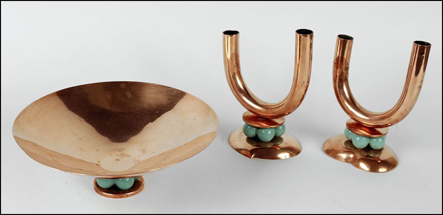ROYALE HICKMAN COPPER TABLE SET.: ROYALE HICKMAN COPPER TABLE SET. Comprised of a tazza and a pair of two-light candlesticks (H: 6.75''). Stamped beneath. With painted porcelain ring form additions Tazza H: 3.75'' Diameter: 10.5''