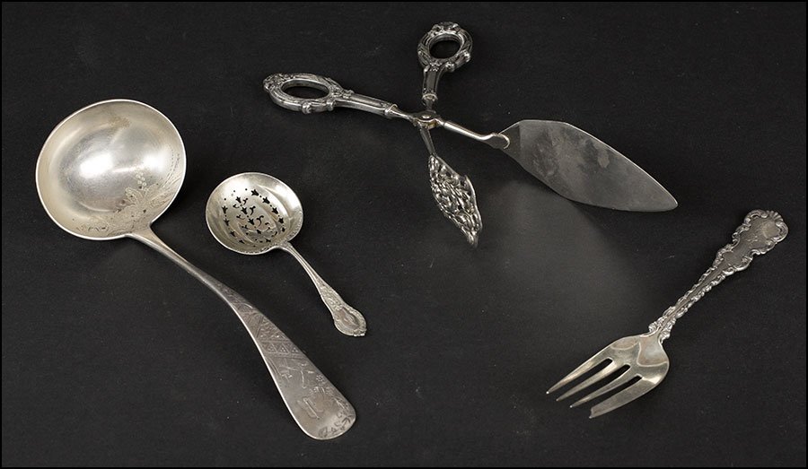 A GROUP OF STERLING SERVING UTENSILS.: A GROUP OF STERLING SERVING UTENSILS. Comprising a ladle, a cold meat fork, a pierced spoon, and a sterling handled set of tongs Weighable pieces: 5 ozt
