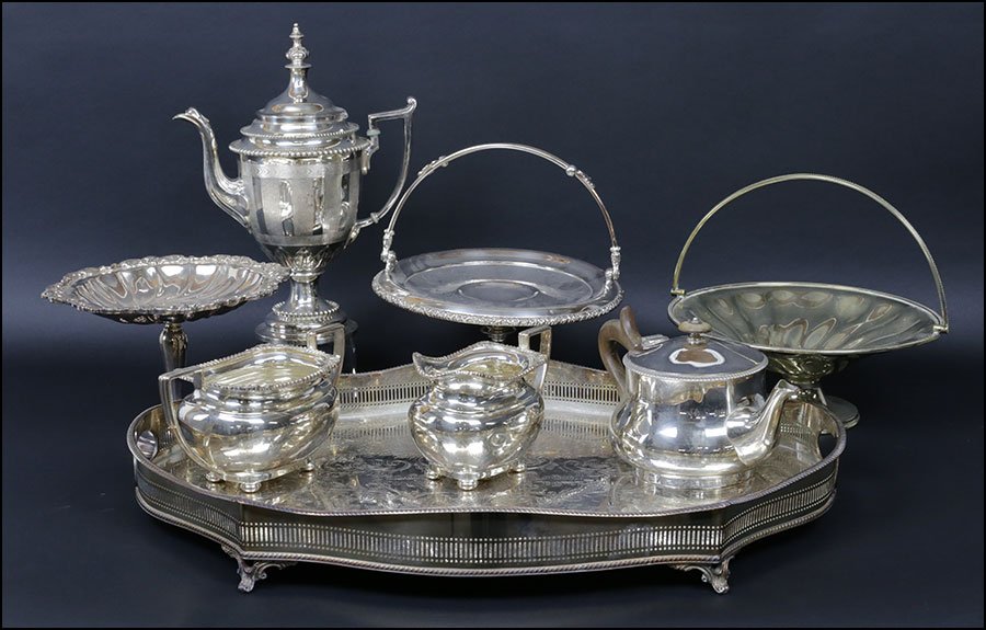 COLLECTION OF SILVERPLATE TABLE ARTICLES.: COLLECTION OF SILVERPLATE TABLE ARTICLES. Comprising a Sheffield reticulated silverplate tray, a Sheffield silverplate cream and waste bowl, a coffee pot, teapot, Wallace "Baroque" compote, and two br