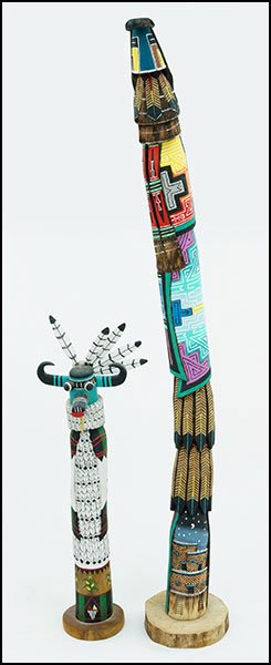 TWO SHALAKO KACHINA DOLLS.: TWO SHALAKO KACHINA DOLLS. One 'Long Hair' signed 'H.J.' and one horned signed 'Antonio Charomiah' Taller: 36"