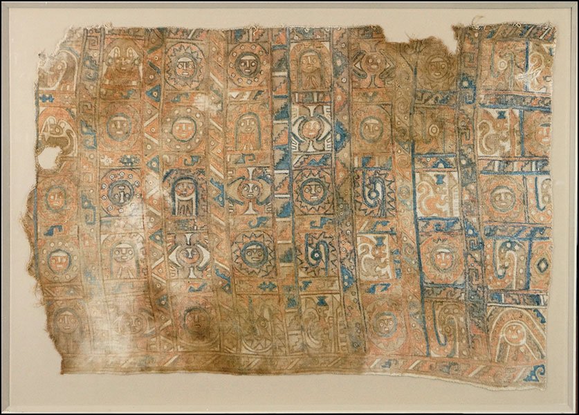 PRE-COLOMBIAN PERUVIAN TAPESTRY FRAGMENT.: PRE-COLOMBIAN PERUVIAN TAPESTRY FRAGMENT. From Peru. Mounted in 1974. Bearing warriors, suns, and other tribal figures throughout Frame: 27.75'' x 39.75''