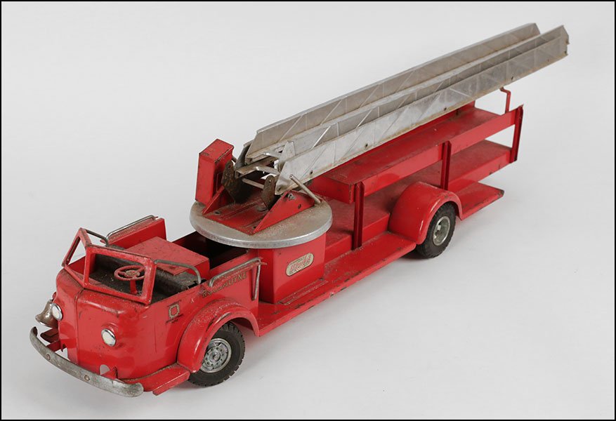 A DOEPKE PRESSED STEEL MODEL TOYS FIRETRUCK.: A DOEPKE PRESSED STEEL MODEL TOYS FIRETRUCK. With an 'Authorized American - La France Alfco' sticker and 'Rossmoyne.' With a movable ladder L: 34''