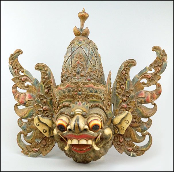 A BALINESE TOPENG POLYCHROME DECORATED WOOD DANCING: A BALINESE TOPENG POLYCHROME DECORATED WOOD DANCING MASK. Fitted as a decorative wall hanging 30'' x 30'' x 9''