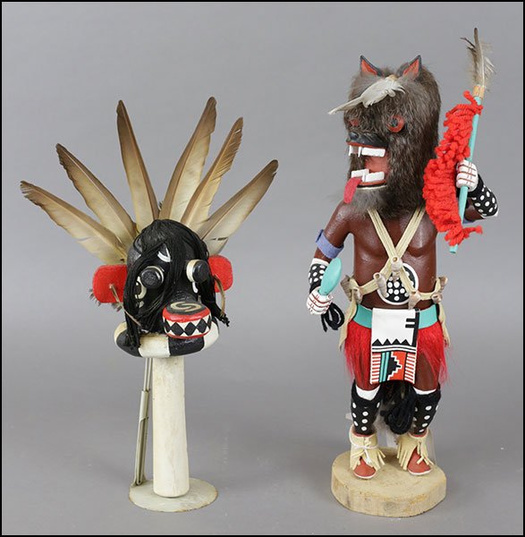 AN 'ALFRED REED, JR.' BROWN WOLF KACHINA DOLL FIGURE.: AN 'ALFRED REED, JR.' BROWN WOLF KACHINA DOLL FIGURE. Together with a 'Chaveyo' Giant Ogre rattle. Doll is titled, dated 1982, and signed on the underside (length: 13") Figure: 15"