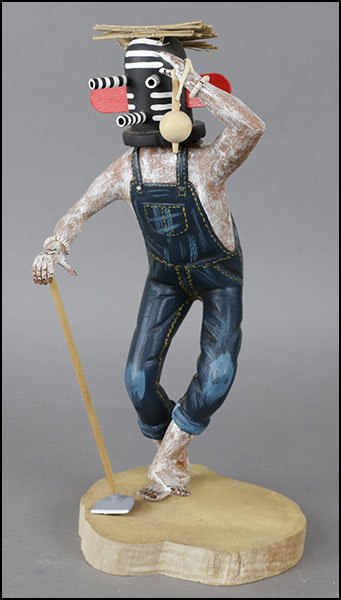 A RAYMOND PARKETT 'KWIKWILYAQA' MOCKING KACHINA DOLL: A RAYMOND PARKETT 'KWIKWILYAQA' MOCKING KACHINA DOLL FIGURE. Titled and signed on the underside Height: 14"