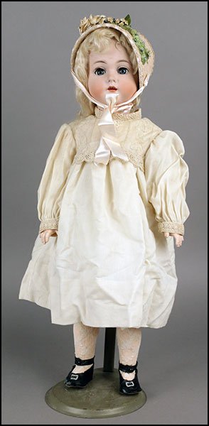 KAMMER & RIENHARDT CHILD BISQUE DOLL.: KAMMER & RIENHARDT CHILD BISQUE DOLL. Of a girl, with a compo body, ball jointed arms, sleepy eyes, an open mouth with teeth. The hallmark is K&R Simon & Halbig 408, Germany 62. Provenance: Kellar and