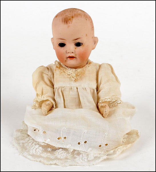 HEUBACH KOPPELSDORF GERMAN BISQUE BABY.: HEUBACH KOPPELSDORF GERMAN BISQUE BABY. Bearing an open mouth with teeth, molded head and hair, composition five-piece body, set eyes, marked "Heubacy Koppelsdorf, 330, 13/0, Germany" H: 9"