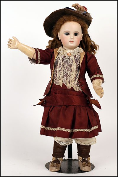 A EMILE JUMEAU NUMBER SIX FRENCH BISQUE DOLL.: A EMILE JUMEAU NUMBER SIX FRENCH BISQUE DOLL. Bearing a closed mouth, set eyes, and a ball jointed composition body. Stamped EJ 6 on neck H: 19''