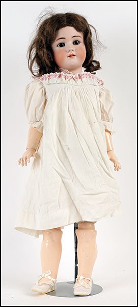 A SIMON & HALBIG HEINRICH HANDWERCK BISQUE PORCELAIN: A SIMON & HALBIG HEINRICH HANDWERCK BISQUE PORCELAIN SOCKET DOLL. Bearing sleepy eyes, an open mouth showing teeth, and an eleven piece composition and wood ball jointed body. Incised on the back, wit