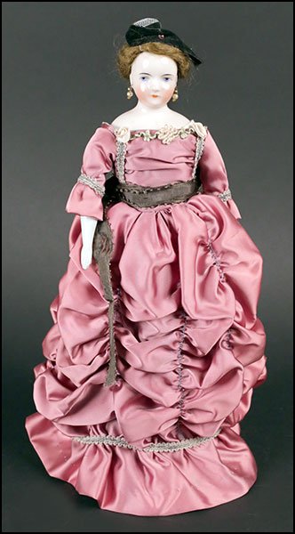 BALD GLAZED HEAD WIGGED CHINA DOLL.: BALD GLAZED HEAD WIGGED CHINA DOLL. Bearing a soft body with china hands & legs H: 15"