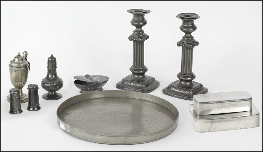 COLLECTION OF PEWTER TABLE ARTICLES.: COLLECTION OF PEWTER TABLE ARTICLES. Comprised of a pair of candlesticks, two salt and pepper shakers, a sugar shaker, a spice box, a mustard, and an Indonesian tray. Together with two English metal f