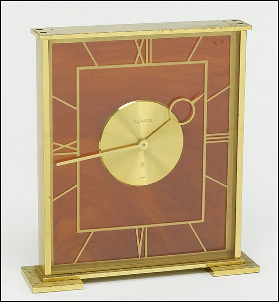 A JAEGER LE COULTRE DESK CLOCK.: A JAEGER LE COULTRE DESK CLOCK. Bearing the number eight with a circle around it. Marked 'Swiss.' With a resin back and roman numeral form numbers 6.5'' x 6'' x 1.5''