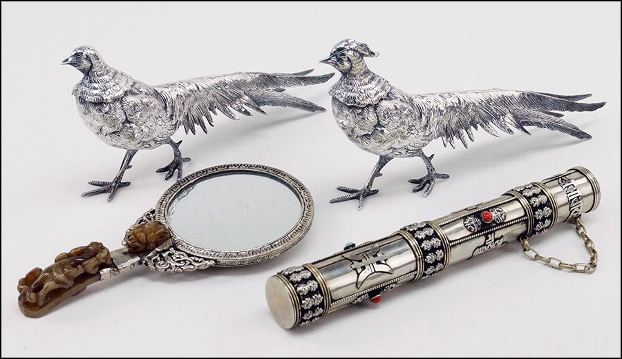 A CARVED STONE BUCKLE HANDLED MIRROR.: A CARVED STONE BUCKLE HANDLED MIRROR. Together with a Turkish scroll holder and a set of two patinated metal pheasant figures. Mirror is adorned with two red stones on the reverse and a dragon and pho
