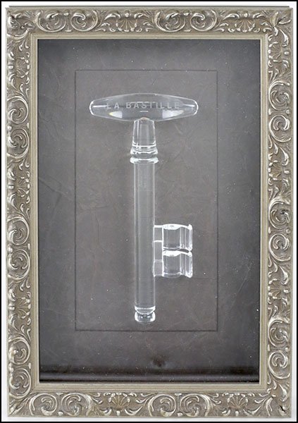A BACCARAT CRYSTAL KEY TO THE BASTILLE.: A BACCARAT CRYSTAL KEY TO THE BASTILLE. Mounted in a shadow box frame Key: 7"