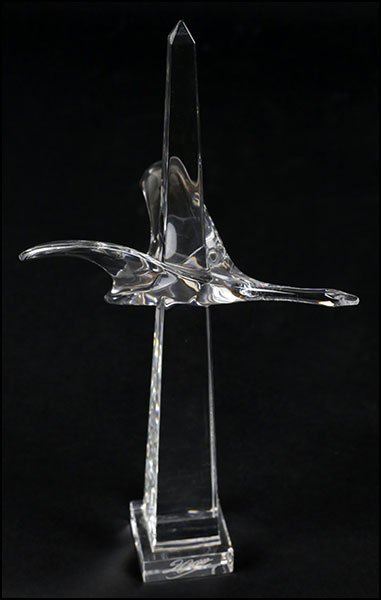 A BACCARAT CRYSTAL SCULPTURE.: A BACCARAT CRYSTAL SCULPTURE. Depicting a bird in flight over an obelisk Height: 10.5"