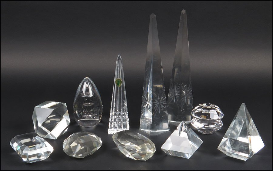 A PAIR OF CRYSTAL OBELISKS.: A PAIR OF CRYSTAL OBELISKS. Together with a Waterford crystal obelisk, a Tiffany & Co. crystal paperweight, and seven crystal paperweights Pair height: 11"