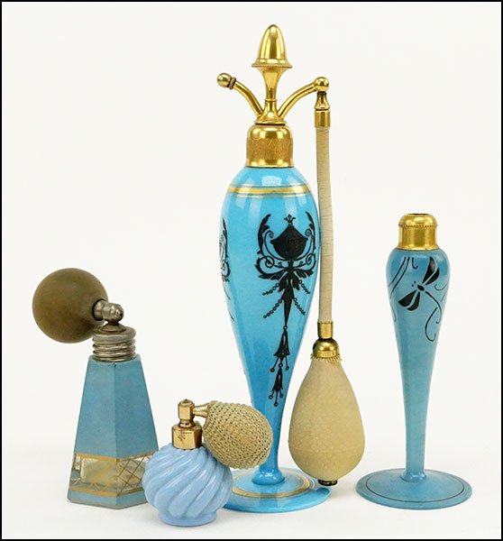 A BLUE OPALINE GLASS PERFUME ATOMIZER.: A BLUE OPALINE GLASS PERFUME ATOMIZER. Together with a DeVilbiss blue camphor glass atomizer and two other blue glass atomizers Height: 9"