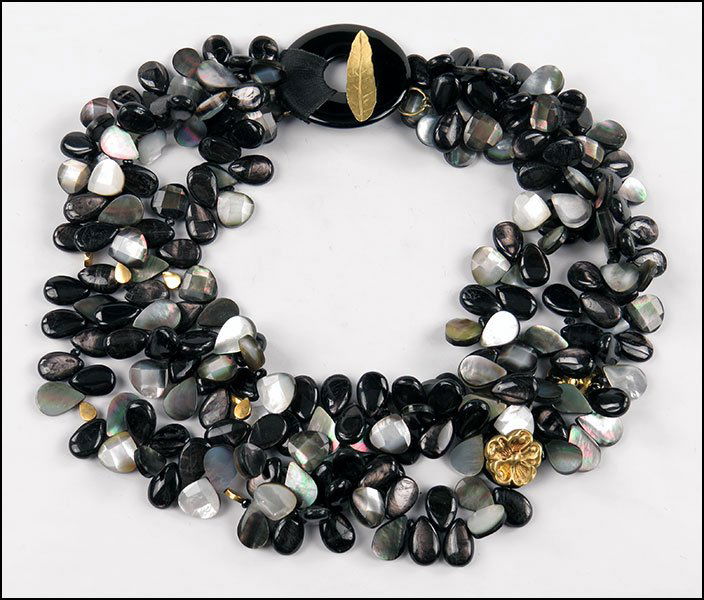 AN ONYX, ABALONE, AND FACETED MOTHER-OF-PEARL TORSADE N: AN ONYX, ABALONE, AND FACETED MOTHER-OF-PEARL TORSADE NECKLACE. Adorned with two 18 karat yellow gold floret links. Provenance: From the Estate of Frances R. Dittmer Length: 19"