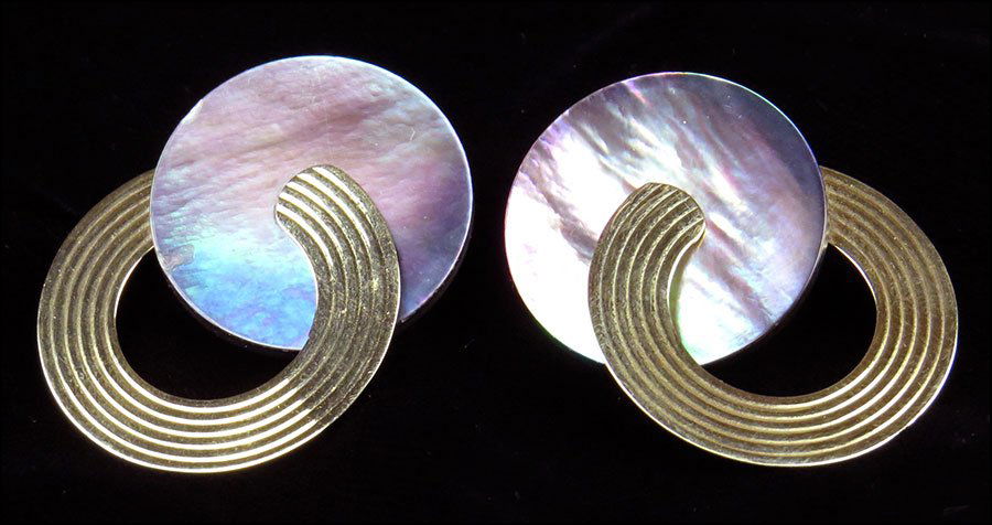 A PAIR OF ABALONE AND 14 KARAT YELLOW GOLD EARRINGS.: A PAIR OF ABALONE AND 14 KARAT YELLOW GOLD EARRINGS. A post on the grooved gold circles is pierced through the abalone circle