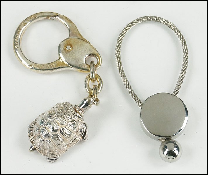 A TIFFANY & COMPANY STERLING SILVER TURTLE KEY RING.: A TIFFANY & COMPANY STERLING SILVER TURTLE KEY RING. With original box. Together with a Giuliana Teso keyring
