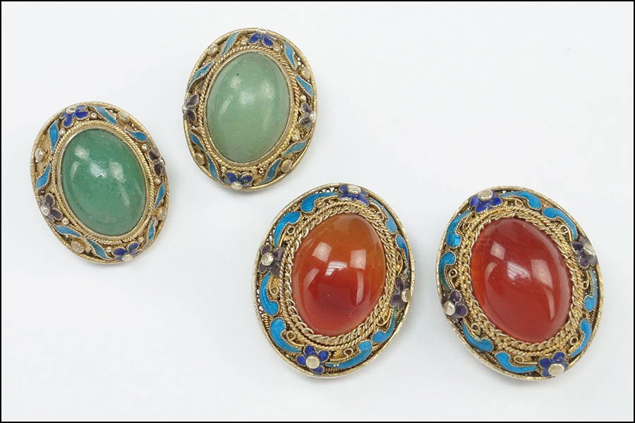 TWO PAIRS OF CHINESE EARCLIPS.: TWO PAIRS OF CHINESE EARCLIPS. Each mounted with enamel. One pair containing carnelian, while the other contains green quartz