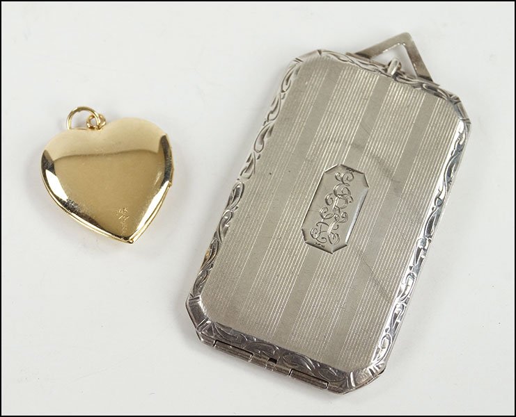 A STERLING SILVER FOUR PHOTO LOCKET.: A STERLING SILVER FOUR PHOTO LOCKET. Together with a 14 karat yellow gold and diamond heart shaped locket