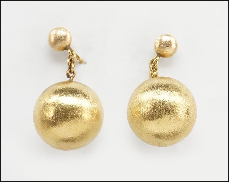 A PAIR OF 14 KARAT YELLOW GOLD EARCLIPS.: A PAIR OF 14 KARAT YELLOW GOLD EARCLIPS. Textured gold balls are suspended from clip backings 8.1 grams
