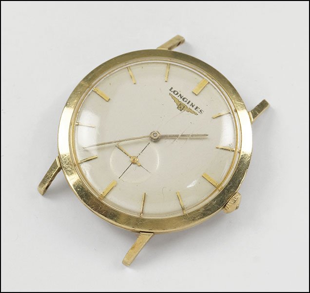 A LONGINES 14 KARAT YELLOW GOLD WATCH.: A LONGINES 14 KARAT YELLOW GOLD WATCH. Reverse of case is engraved "E.C Reeve in Appreciation CBS Radio 1959" 37mm x 34mm