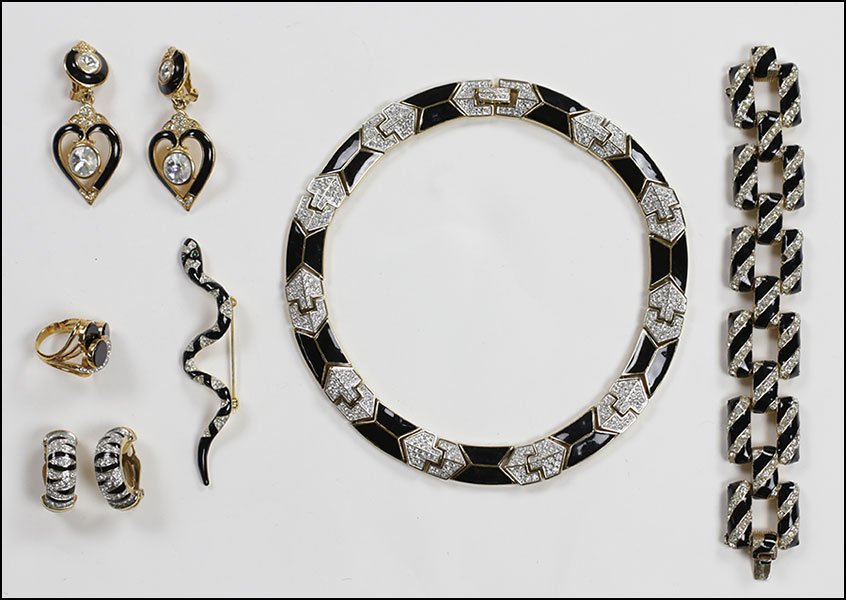 A COLLECTION OF BLACK ENAMEL AND WHITE RHINESTONE JEWEL: A COLLECTION OF BLACK ENAMEL AND WHITE RHINESTONE JEWELRY. Comprising a pair of Bijoux heart form earclips, a pair of striped earclips, one cocktail ring, a Sphinx snakeform brooch, one Ciner link bra