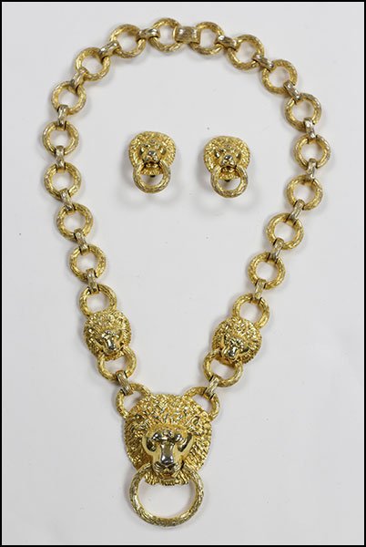 A KENNETH LANE GOLDTONE DEMI-PARURE.: A KENNETH LANE GOLDTONE DEMI-PARURE. Comprising a lion form doorknocker link necklace and a pair of coordinating earclips. All three pieces stamped Kenneth Lane Necklace Length: 22"