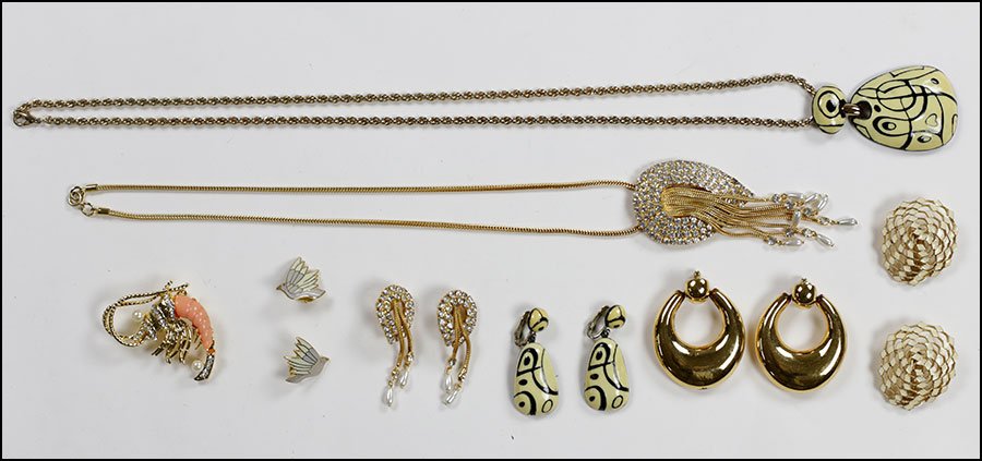 AN EISENBERG ENAMEL DEMI-PARURE.: AN EISENBERG ENAMEL DEMI-PARURE. Comprising a pendant and matching earclips. Together with a pair of signed Monet earclips, one pair of enamel and goldtone earclips, a white rhinestone and goldtone ne