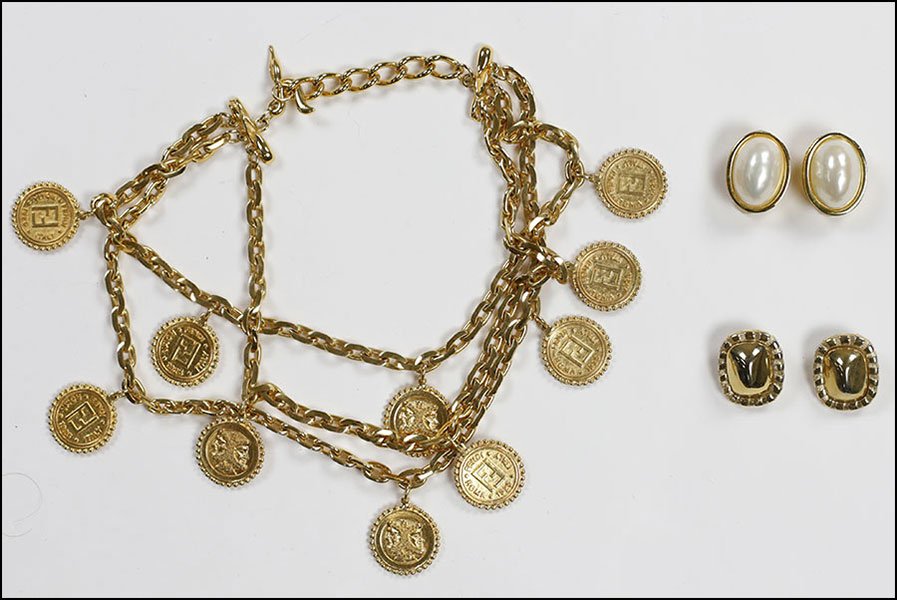 A FENDI TRIPLE STRAND GOLDTONE NECKLACE WITH COIN CHARM: A FENDI TRIPLE STRAND GOLDTONE NECKLACE WITH COIN CHARMS. Together with two pairs of Fendi earclips. All pieces are signed Necklace Length: 14"