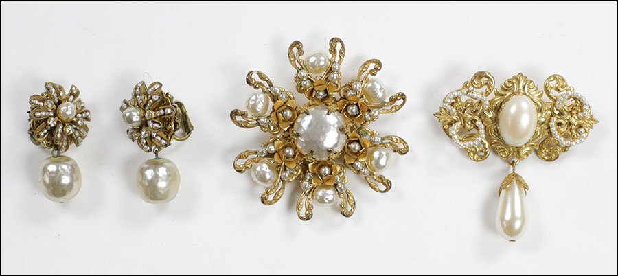 A PAIR OF MIRIAM HASKELL FAUX BAROQUE PEARL EARCLIPS.: A PAIR OF MIRIAM HASKELL FAUX BAROQUE PEARL EARCLIPS. Together with one faux Baroque pearl starburst brooch and one faux pearl drop brooch Starburst Brooch: 2"