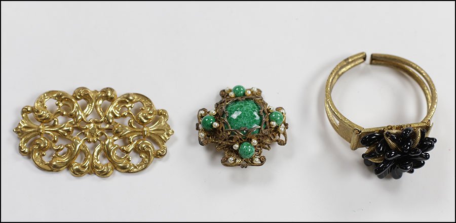 A MIRIAM HASKELL GOLDTONE AND BLACK BEADED BRACELET.: A MIRIAM HASKELL GOLDTONE AND BLACK BEADED BRACELET. Together with two signed goldtone brooches, one with green beads Bracelet Width: 2.5"