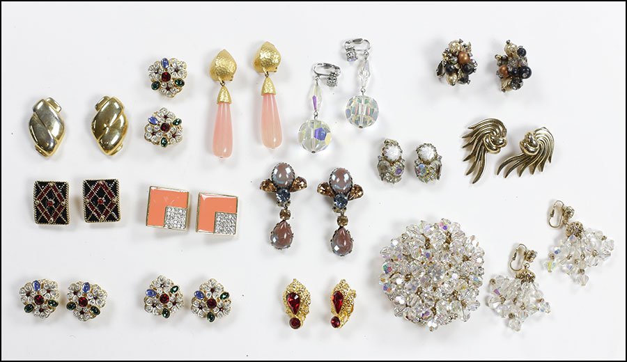 TWO PAIRS OF GIVENCHY EARCLIPS.: TWO PAIRS OF GIVENCHY EARCLIPS. Together with an aurora borealis rhinestone demi-parure, eight pairs of earclips, and three pairs of matching white and red rhinestone earclips Brooch: 2.5"