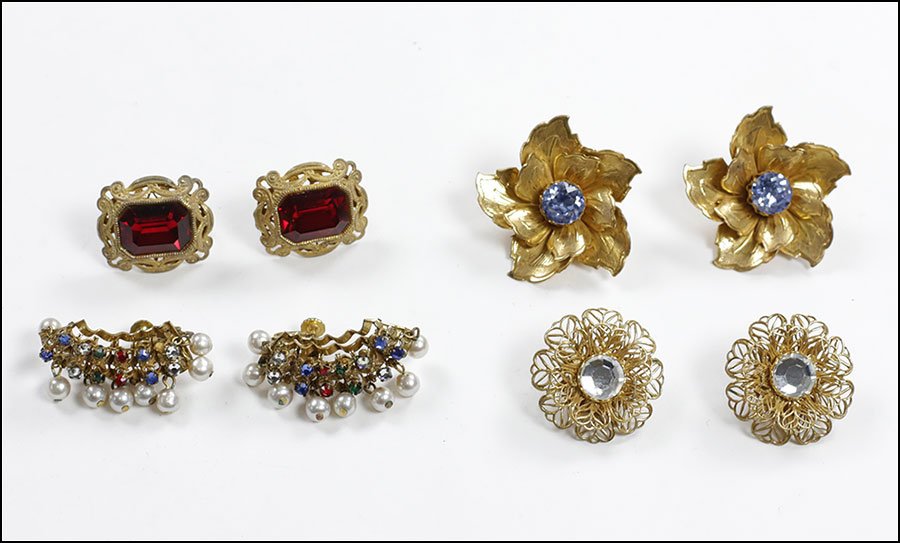 FOUR PAIRS OF MIRIAM HASKELL EARCLIPS.: FOUR PAIRS OF MIRIAM HASKELL EARCLIPS. One pair of flower form earclips with periwinkle rhinestone centers. One pair of flower form earclips with white rhinestone centers. One pair of rectangular form