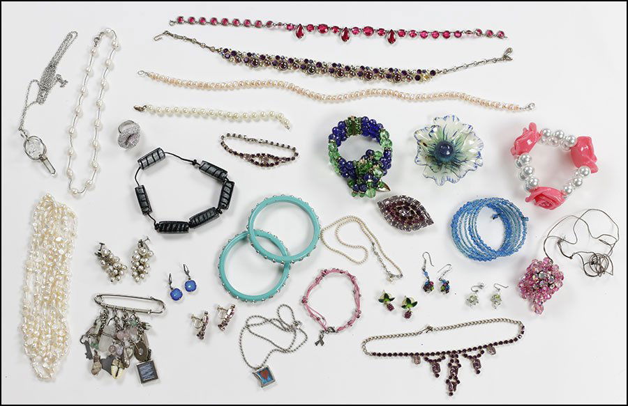 A PAIR OF MIRIAM HASKELL FAUX BAROQUE PEARL EARCLIPS.: A PAIR OF MIRIAM HASKELL FAUX BAROQUE PEARL EARCLIPS. Together with a purple rhinestone parure, faux pearl necklaces, a pair of blue and white rhinestone wooden bangles, an assortment of rhinestone je