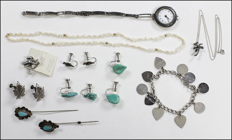 TWO STERLING SILVER AND TURQUOISE STICK PINS.: TWO STERLING SILVER AND TURQUOISE STICK PINS. Pins are base metal, while mounting containing turquoise is silver. Together with a pair of sterling silver leaf form screwback earrings, a sterling silve