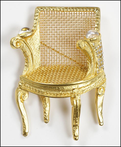 A KARL LAGERFELD GILT METAL AND RHINESTONE CHAIR BROOCH: A KARL LAGERFELD GILT METAL AND RHINESTONE CHAIR BROOCH. 3.5" x 2.5"