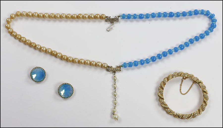 A HATTIE CARNEGIE FAUX PEARL AND BLUE BEAD TWO-STRAND N: A HATTIE CARNEGIE FAUX PEARL AND BLUE BEAD TWO-STRAND NECKLACE. Together with a pair of Hattie Carnegie blue button earclips and a Hattie Carnegie gold tone bangle bracelet