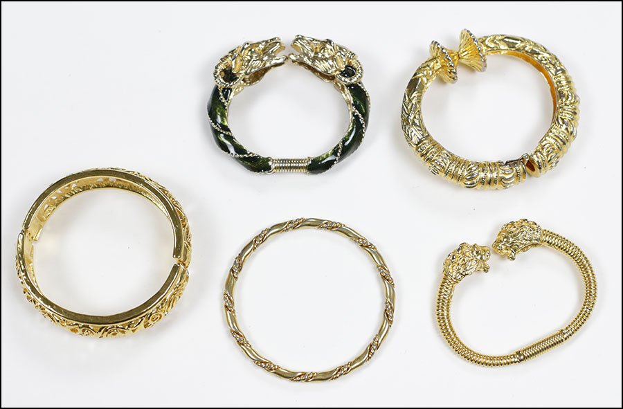 A COLLECTION OF GOLDTONE BRACELETS.: A COLLECTION OF GOLDTONE BRACELETS. Comprising five bracelets including two by Kenneth Lane and one by Donald Stannard